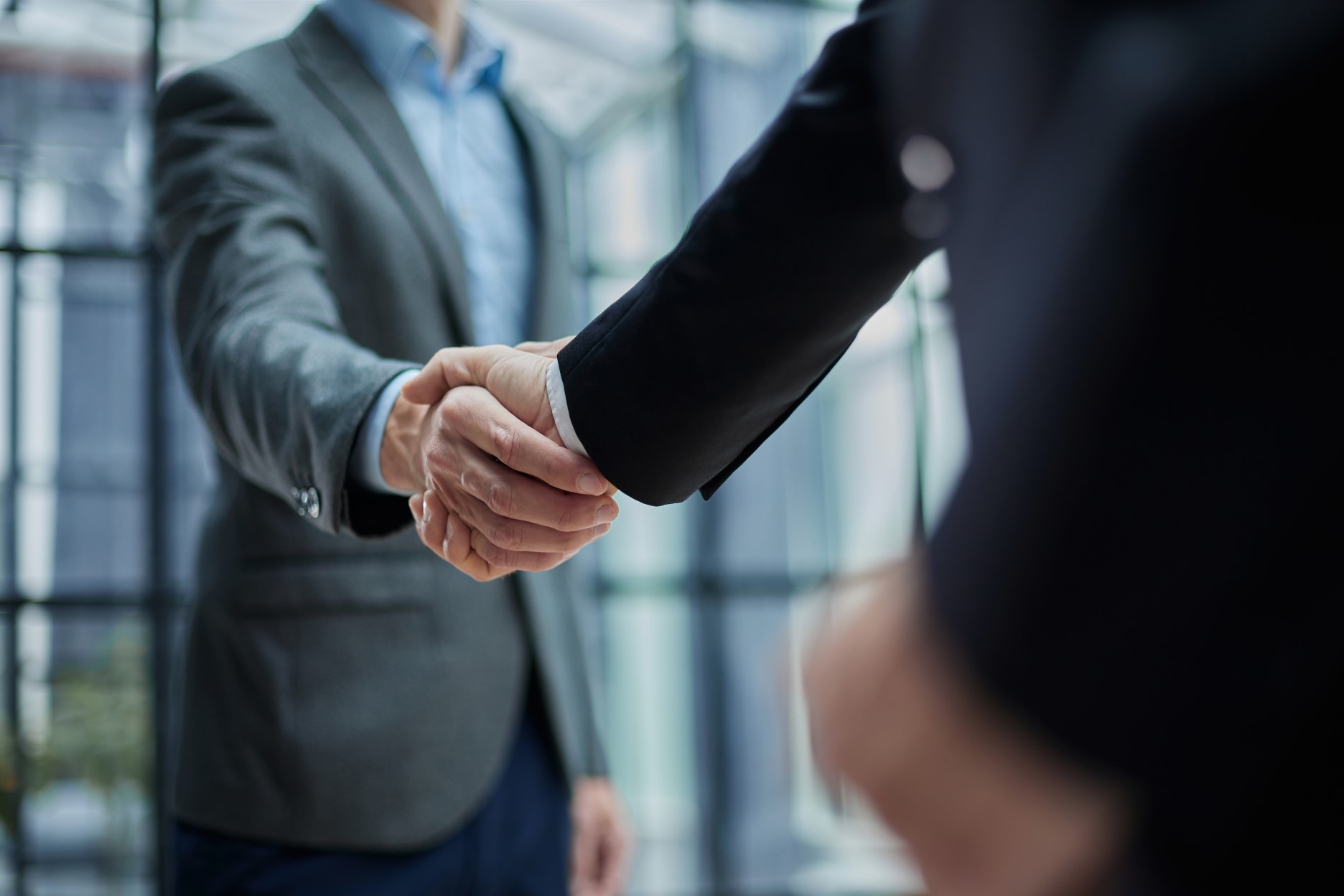 Executive leaders shaking hands
